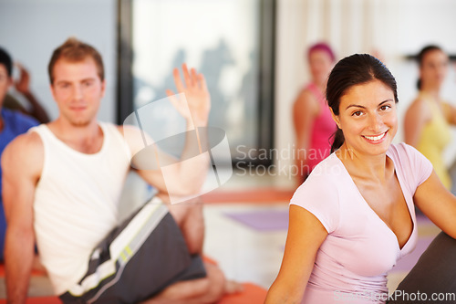 Image of Portrait, stretching and woman in yoga class for fitness, body exercise and happy mindfulness. Club, pilates and group of people in holistic health retreat for wellness, balance and smile on face.