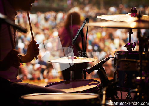 Image of Drums, playing and closeup of hands, concert and music festival in outdoors, talent and audience. Band, performance and entertainment for crowd, instrument and rhythm for people, sound and rock