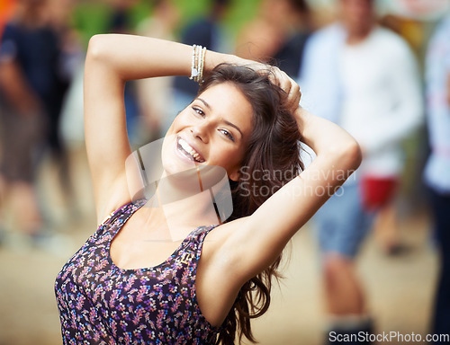 Image of Portrait, smile and energy with a woman at a music festival to dance while having fun during a concert. Face, freedom and a happy young person at an event, show or performance to party outdoor