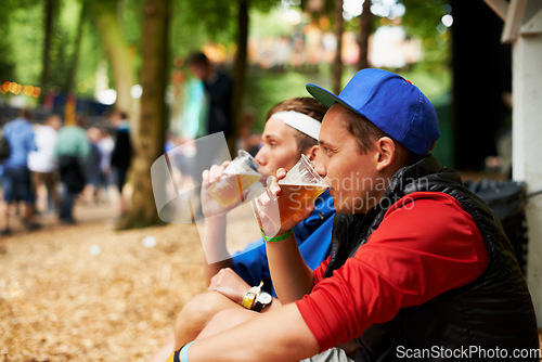 Image of Beer, nature festival and relax friends drinking for break, wellness beverage or woods social event. Forest music concert, drunk men and outdoor people sitting with alcohol product, cup or liquid