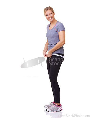 Image of Fitness, measuring tape and portrait of happy woman with smile, workout and wellness with healthy body in studio. Health, exercise and girl with weight loss measurement isolated on white background.