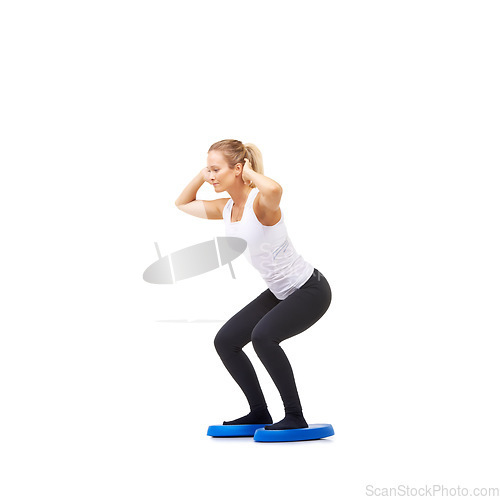 Image of Balance, exercise and fitness with woman on disc in studio for workout, mindfulness or squats. Wellness, challenge and training with person on white background for flexibility, smile or aerobics