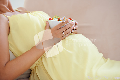 Image of Pregnant woman, eating salad and living room couch, alone and enjoying delicious pregnancy craving. Relaxed, vegetables and maternity wellness with healthy food meal and nutrition satisfaction