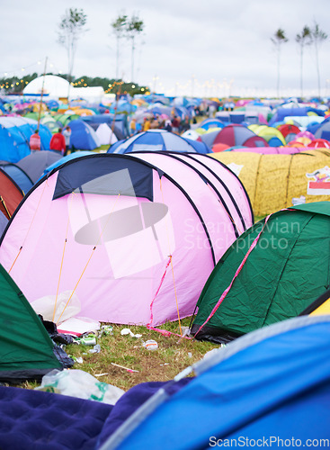 Image of Tents, campsite and music festival on outdoor field or mess pollution, garbage from party crowd. Shelter, group and entertainment dance gathering event or waste land for holiday, dirt in environment