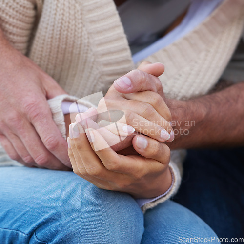 Image of Couple, holding hands and closeup with love, care and support with empathy for illness, diagnosis or cancer. Solidarity, man and woman with gratitude, respect or comfort partner in crisis of health