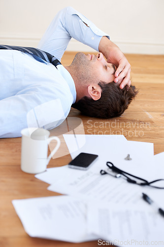 Image of Businessman, stress and headache or burnout, floor and exhausted or mental health, paperwork and overwhelmed. Male person, migraine and tired or frustrated, rest and fatigue for mistake and fail