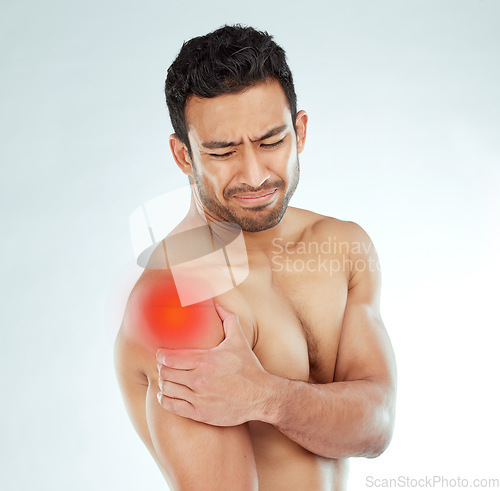 Image of Shoulder pain, stress and asian fitness man in studio with muscle tension, arthritis or inflammation on white background. Sports, injury and face of Japanese model with fibromyalgia or osteoporosis