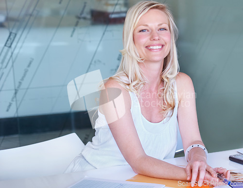 Image of Portrait, happy business woman at desk or creative professional entrepreneur in office. Face smile, designer or employee at table, worker or young blonde person in Australia for startup career or job