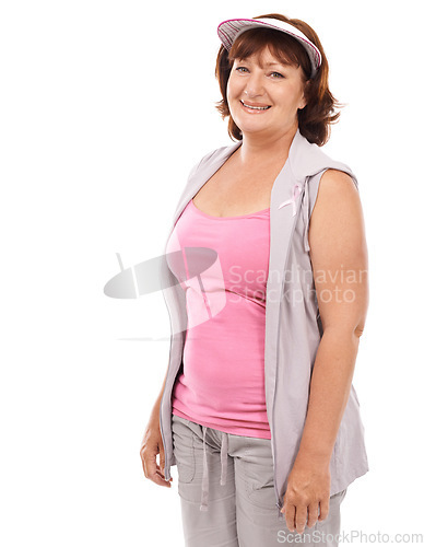 Image of Portrait, breast cancer ribbon and mature happy woman with survivor wellness, awareness or empathy support. Smile, health sign and model with bow icon for studio campaign isolated on white background