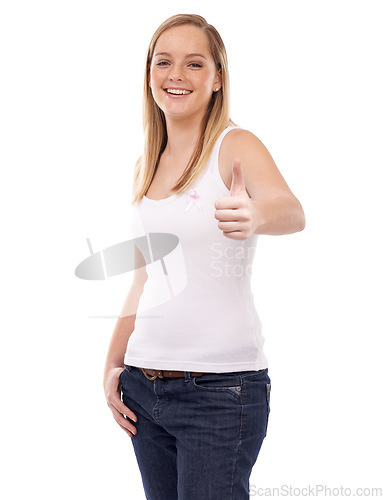 Image of Happy woman, portrait and thumbs up for breast cancer, support or awareness against a white studio background. Blonde female person smile with like emoji, yes sign or OK with pink ribbon for campaign