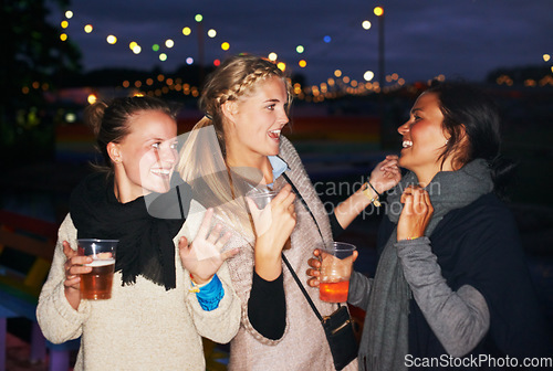 Image of Friends, beer outdoor at night or music festival in forest adventure, nature celebration or group connection. Woman, face and smile for alcohol drinking or cheers toast for summer, travel or vacation