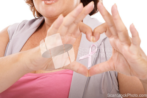 Image of Woman, ribbon and heart hands for breast cancer awareness, love or care against a white studio background. Closeup of female person with like emoji, symbol or gesture in support or community campaign