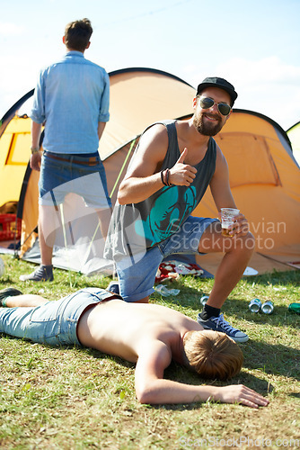 Image of Sleeping, drunk or friends on grass in festival hangover in a social celebration or party or concert. Portrait, thumbs up or happy people drinking alcohol on outdoor music event or holiday vacation