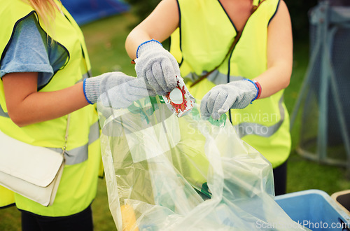 Image of Waste, cleaner and people outdoor with a trash bag to recycle, garbage or beer can at festival. Volunteer, cleaning or hands of janitor with plastic, litter or working at event with junk or rubbish