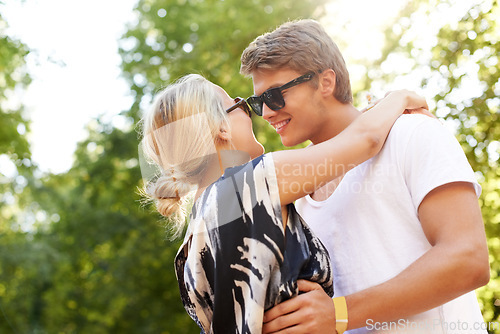 Image of Summer, hug and couple with love in forest, park or trees in woods for adventure on holiday or vacation. Happy, man and woman in embrace together with care, support and fun in nature or environment