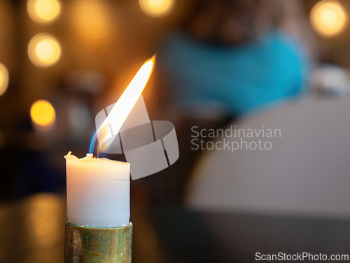 Image of White candle burning