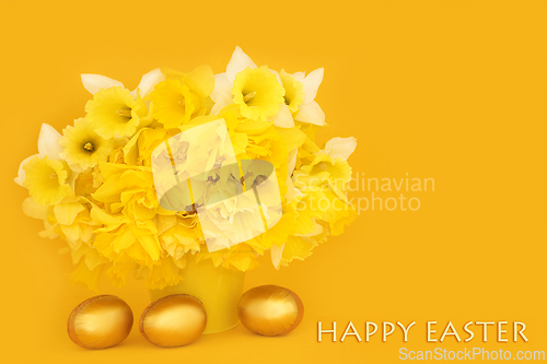 Image of Happy Easter with Gold Eggs and Spring Daffodil Flowers