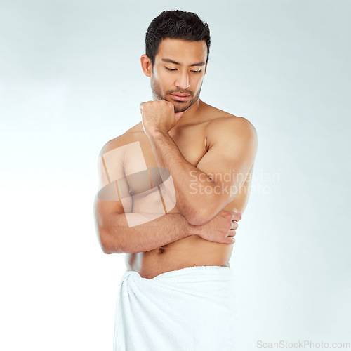 Image of Shower, towel and fitness man thinking in studio for wellness, hygiene or body care routine on white background. Cleaning, grooming or muscular Japanese male model with pamper, cosmetics or treatment