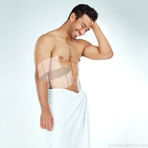 Image of Cleaning, towel and happy fitness man in studio for wellness, hygiene or body care routine on white background. Shower, grooming or muscular Japanese male model with pamper, cosmetics or treatment