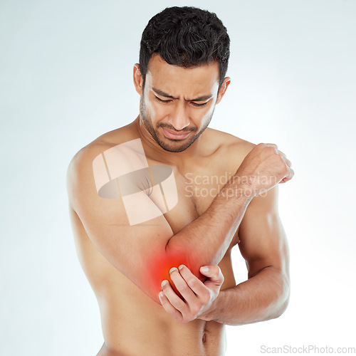 Image of Elbow pain, stress and asian fitness man in studio with muscle tension, arthritis or inflammation on white background. Sports, arm injury and Japanese male model with fibromyalgia or osteoporosis