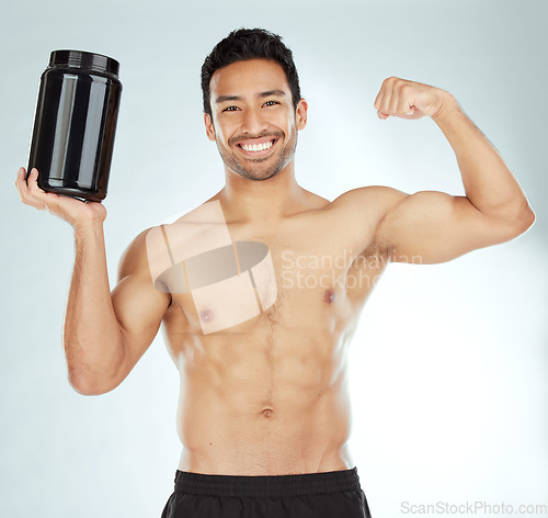 Image of Fitness, portrait and man with protein or bicep flex in studio for workout, exercise or gain on white background. Product, whey and model face with strong arm for muscle growth or supplement support