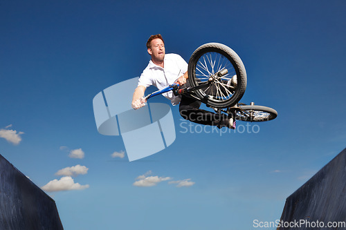 Image of Ramp, jump and man with bike in sky at park, event or competition for sport with risk and energy. Mockup, space and person in air with trick or stunt on bicycle for fun in summer with adventure