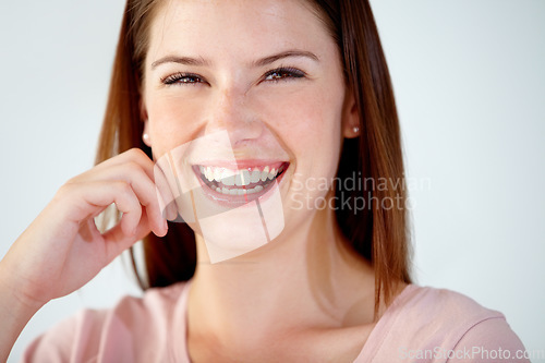 Image of Smile, portrait and young woman in the office with positive, good and confident attitude. Happy, creative career and face of professional female designer from Australia with pride in modern workplace