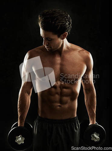 Image of Topless, black background or bodybuilder in dumbbell workout, strength training or exercise in studio. Fitness model, dark or ripped man with healthy body, weights or biceps muscle for lifting power