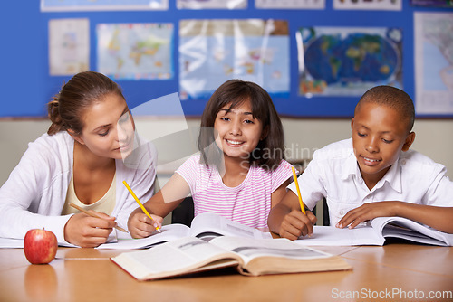 Image of Teacher, girl and school kids in classroom, portrait and writing, learning together and development with studying. Woman, children and help with notebook for support, teaching or education with smile