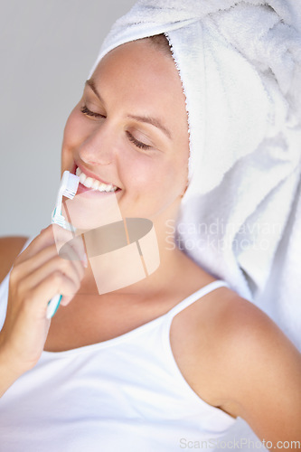 Image of Woman, brushing teeth and smile for healthy care in bathroom for hygiene mouth, dental gum or wellness. Female person, toothbrush and whitening routine for orthodontics, oral glow or gingivitis shine