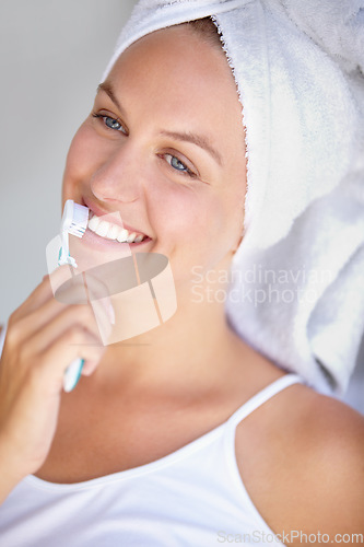 Image of Woman, brushing teeth and smile for healthy in bathroom for hygiene mouth, gum dental care or wellness. Female person, toothbrush and whitening routine for orthodontics, oral glow or gingivitis shine