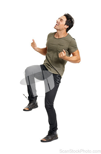 Image of Man, happy and jumping for celebration, excited and energy by white background in studio. Male person, freedom and victory or winner, carefree and ecstatic for achievement in competition or joy