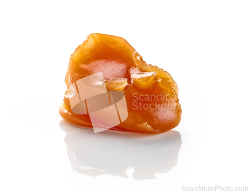 Image of caramel candy on white background