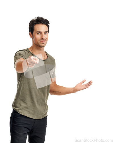 Image of Happy, pointing and portrait of man in a studio for direction, option or choice expression with confidence. Smile, fashion and handsome young male model with a show hand gesture by white background.