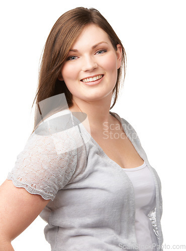 Image of Portrait, smile and fashion with a plus size woman in studio isolated on a white background for style. Face, happy and clothes with a trendy young body positive model in a casual clothing outfit