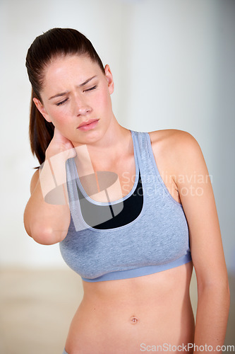 Image of Neck pain, woman and injury with exercise, fitness or training for wellness, healthy body and health. Person, athlete and distressed, moody or unhappy with bruise, strain or overwork from workout