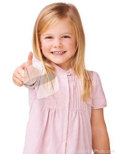 Image of Thumbs up, smile and portrait of child in a studio with positive, good and confident attitude. Happy, young and girl kid with approval, agreement or satisfaction hand gesture by white background.
