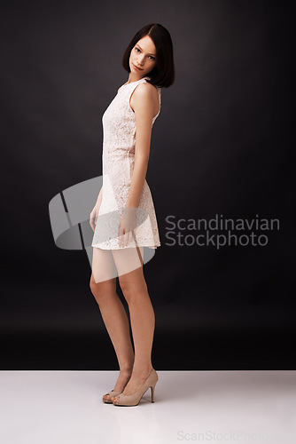 Image of Fashion, confidence and portrait of woman in studio in trendy, stylish dress and formal clothes. Attractive, beauty and full body of person with cosmetics, style and wellness on dark background