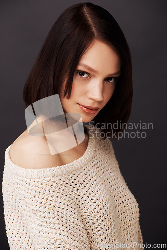 Image of Beauty, jersey and portrait of woman on dark background for fashion, winter style and trendy clothes. Confidence, shoulder and face of natural person with sweater for cozy, comfort and warm in studio