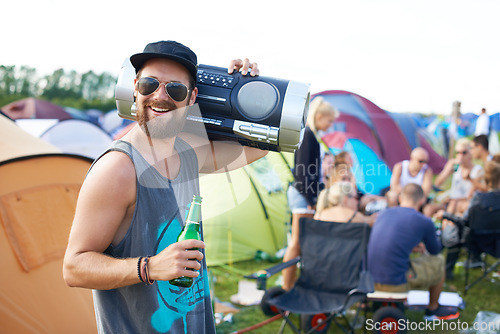 Image of Music festival, alcohol and man with boombox outdoors for social party, celebration and camp event. Happy, excited and person with beer or beverage at musical concert for freedom, vacation and radio