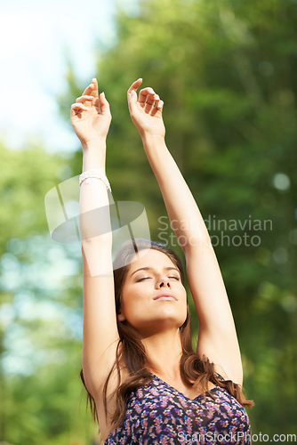 Image of Freedom, peace and woman in a park with arms up, breathing and relax in nature outdoor. Face, calm and female person in forest with positive mindset, eyes closed and gratitude or mindfulness outside