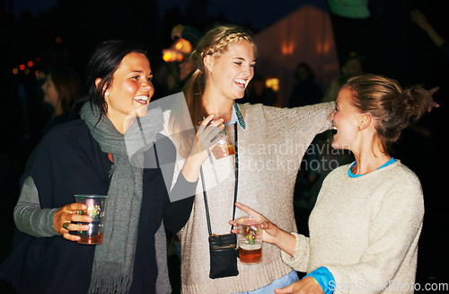 Image of Woman, beer outdoor at night or music festival in forest adventure, nature celebration or group connection. Friends, face and smile for alcohol drinking or dancing techno for summer, travel or crowd