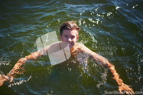 Image of Lake, portrait or teenager in nature swimming with carefree fun, freedom or adventure in summer. Smile, boy or excited male person in river water or dam for holiday travel or outdoor vacation trip