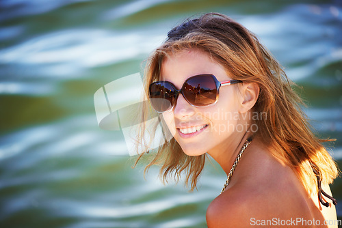 Image of Lake, portrait or happy woman in nature to relax with sunglasses, freedom or adventure in summer. Smile, paradise or female person in river water or dam for holiday travel, peace or outdoor vacation