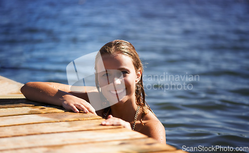 Image of Lake, portrait or happy woman in swimming with freedom, wellness or adventure in summer. Smile, paradise or female person in river water or dam for a fun holiday travel, peace or outdoor vacation