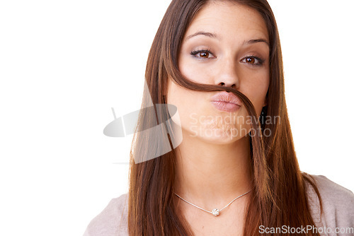 Image of Funny, portrait and woman with hair as a mustache in studio, white background or model with confidence. Person, pouting and posing with hairstyle, beauty or silly girl with crazy expression or face