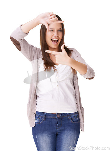 Image of Portrait, hands and woman with selfie frame in studio for photography, gesture or sign on white background. Finger, border and person face with emoji wink for social media, profile picture or memory