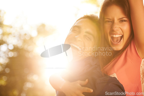 Image of Love, energy and portrait of happy couple in a park with piggyback, fun or bonding together. Freedom, face and excited people in a forest for back ride, support and adventure in the woods at sunset