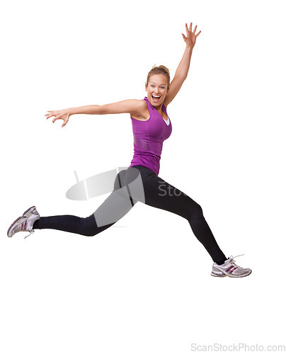 Image of Woman, winner and jump for fitness success, workout and training celebration, energy or achievement in studio. Portrait of sports model or runner in air for exercise and cardio on a white background