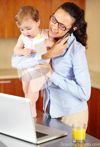 Image of Mother, baby and phone call on laptop for work from home, business planning and multitasking in kitchen. Single mom, woman or freelancer talking on mobile and computer for communication and childcare